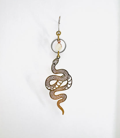 gold and silver Snake-shaped earring on a white background