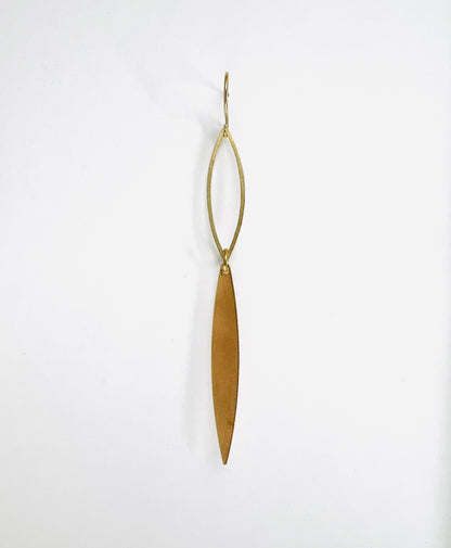 Minimal brass single earring, handcrafted intentional mix-and-match jewelry. Gold earring on a white background