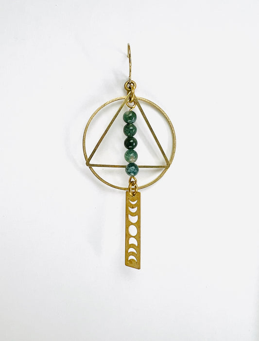 Gold geometric pendant with green beads and moon phase design on a white background