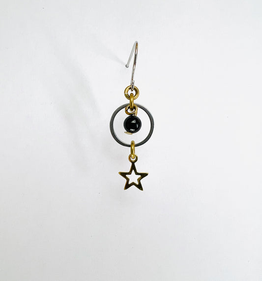 Onyx and star single crystal earring, handmade manifestation jewelry designed to support grounding, resilience, and personal strength.