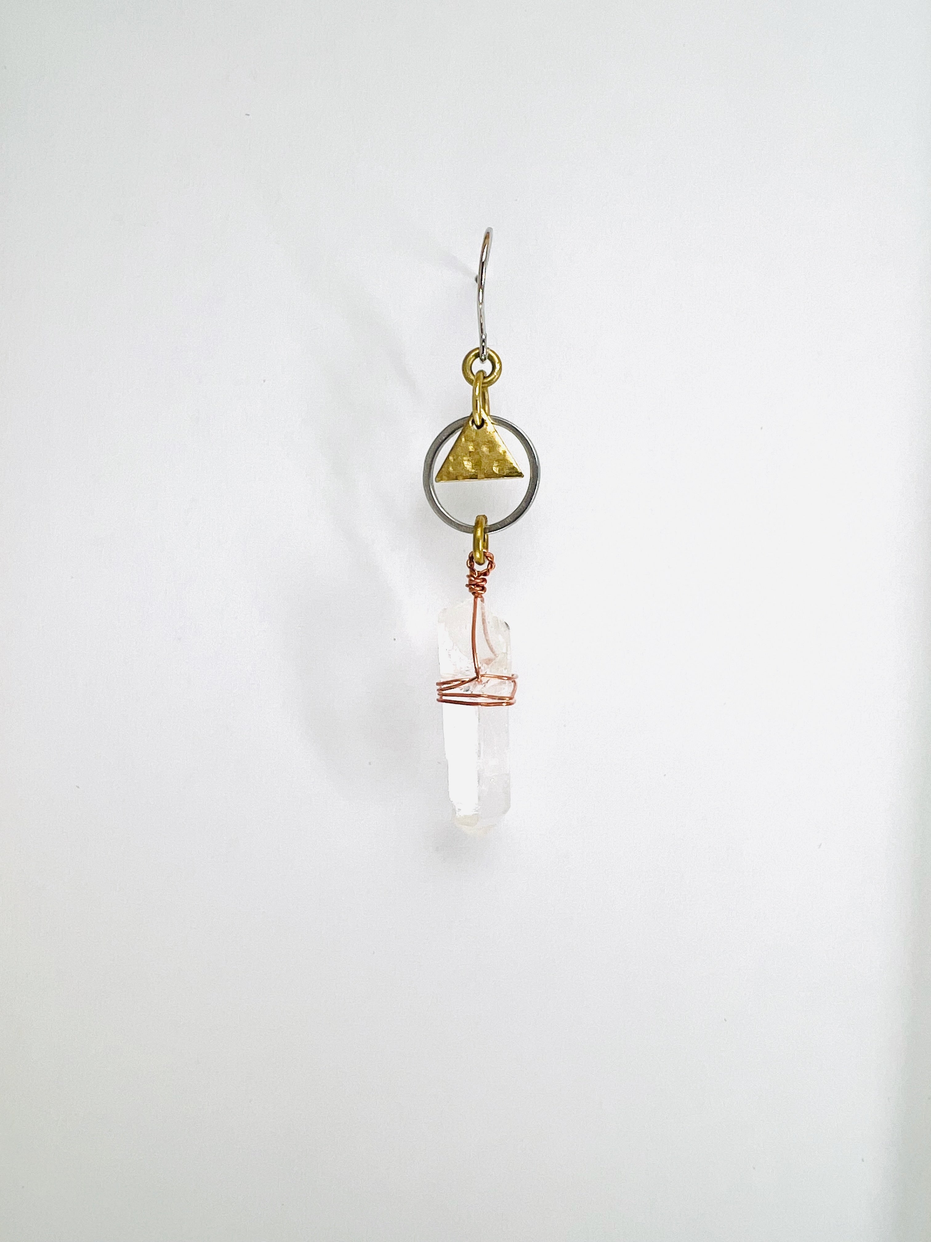 Raw Clear Quartz single crystal earring, handmade manifestation jewelry designed to support clarity, focus, and energetic balance.