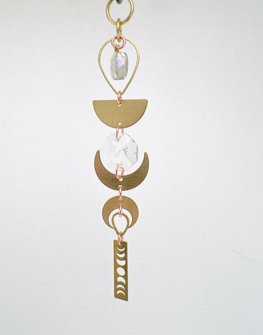 Smoky Quartz manifestation mini charm, handcrafted spiritual décor designed to support grounding, protection, and emotional balance. Decorative hanging with gold elements on a light gray background