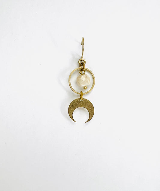 A single light gold crystal earring featuring a cream sunstone and a crescent moon charm, displayed against a white background.